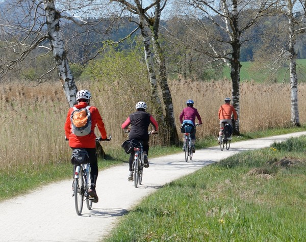 Four cyclists ride down country track staying socially connected